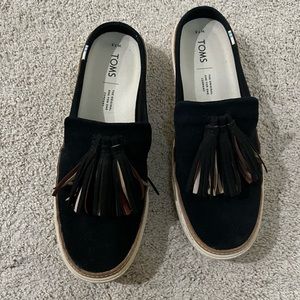 Toms. Black suede slides.